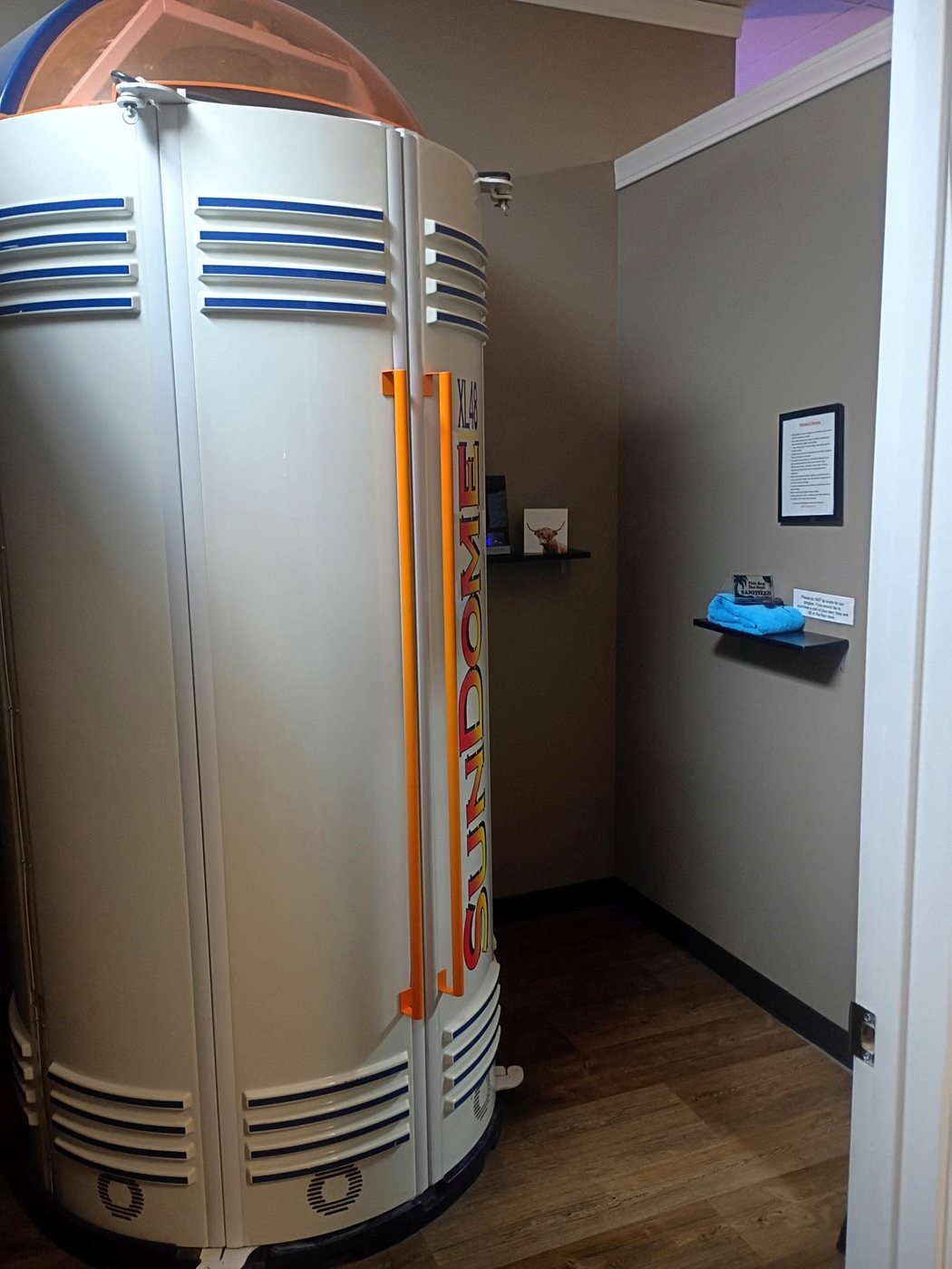 Stand-up tanning booth exterior